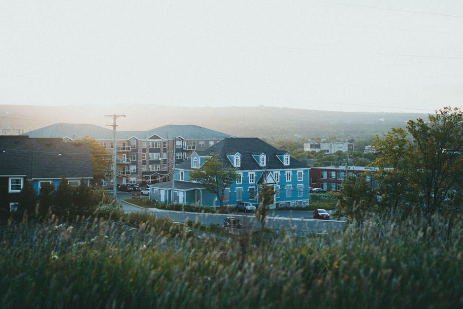 Buildings and Mountain Landscape at Dusk